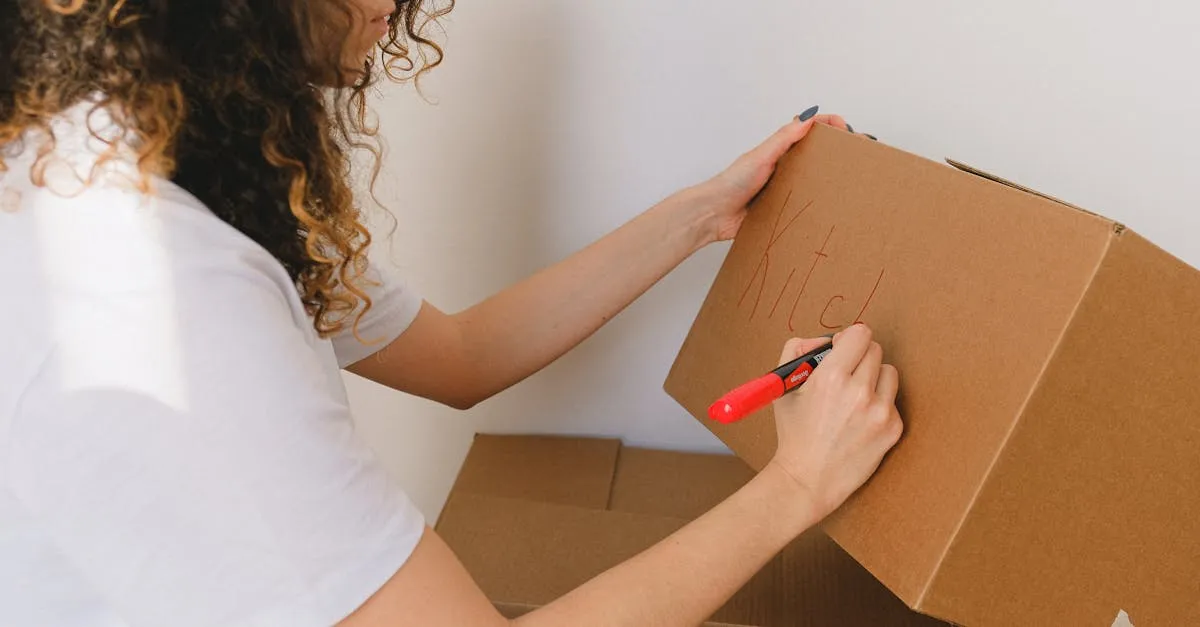 Labeled cardboard moving boxes being organized in an apartment